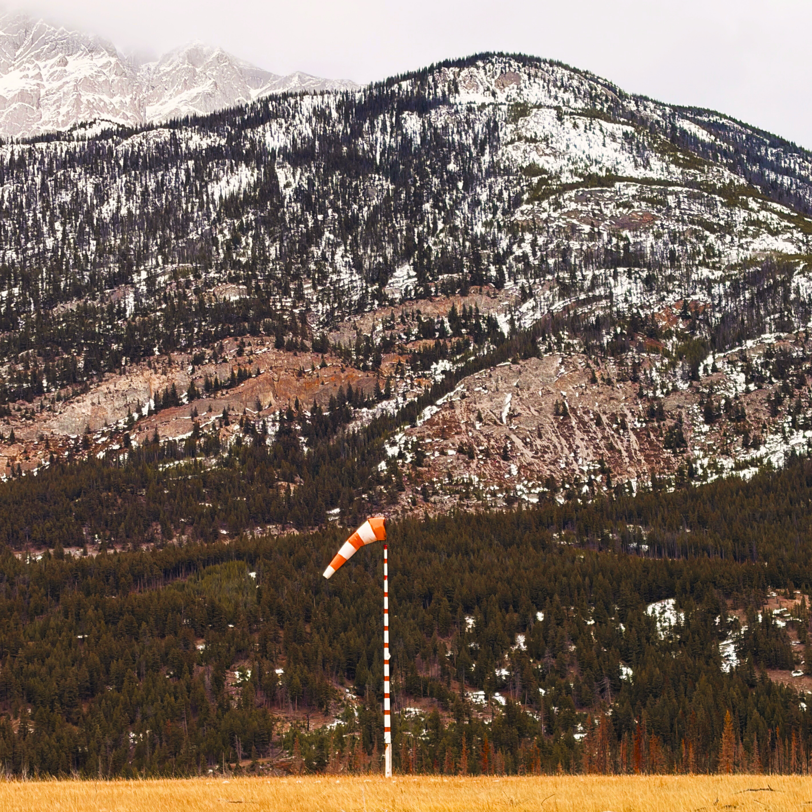 Airport windsock at rural landing strip  